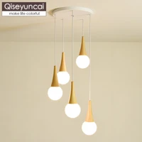 qiseyuncai nordic log three head combination restaurant chandelier modern minimalist bar glass ball magic bean lighting