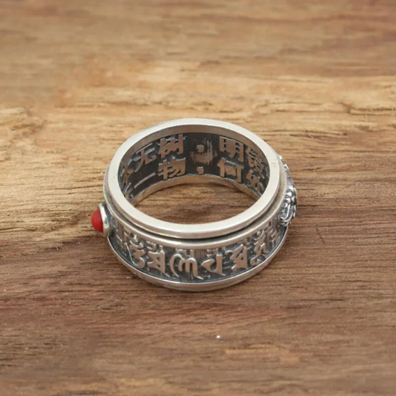 Свадебное кольцо с красным драгоценным камнем вращающееся на 100% градусов в форме