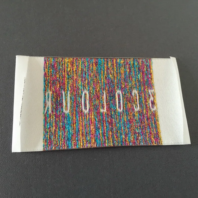 

Custom High Density Metalic Material Letters Woven Labels Clothing Main Label