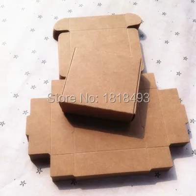 

Free shipping 50pcs a lot 5.8x5.8x3.2cm kraft paper packing box/lovely jewelry case with openings/cute candy box