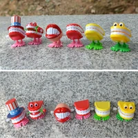creative funny chattering jumping teeth clockwork toy wholesale spring plastic toys jump teeth chain for kids spring toy