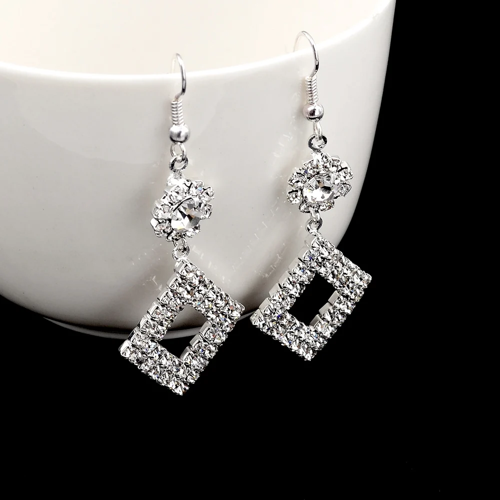 Женские серьги-подвески с кристаллами серебристого цвета | Украшения и