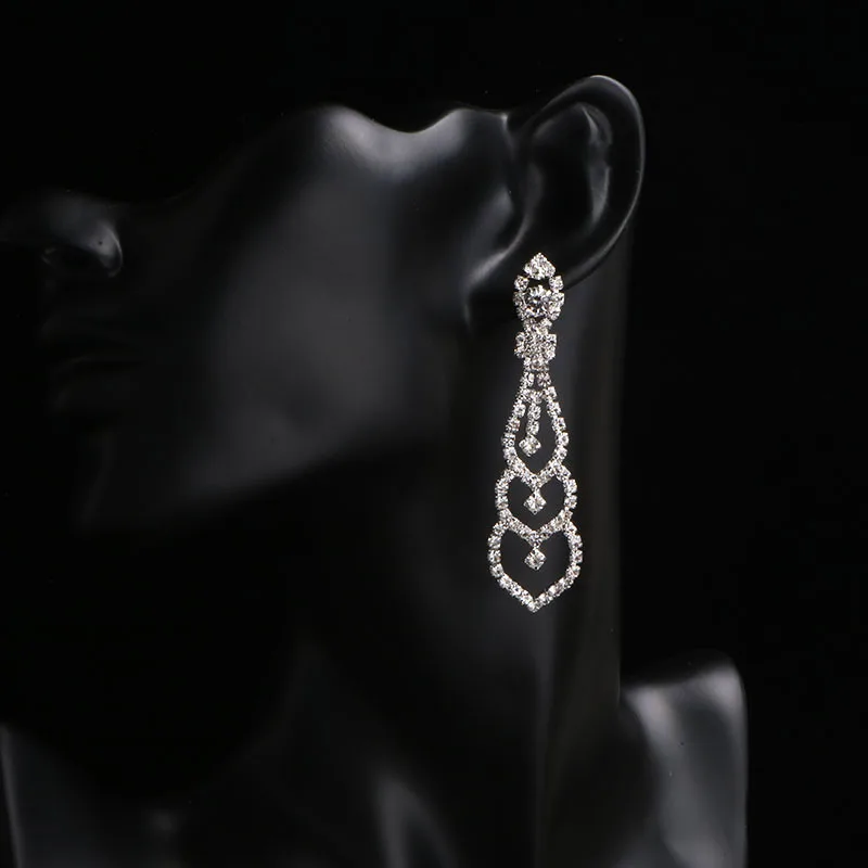 Круглые длинные серьги с кристаллами серебряного цвета | Украшения и аксессуары