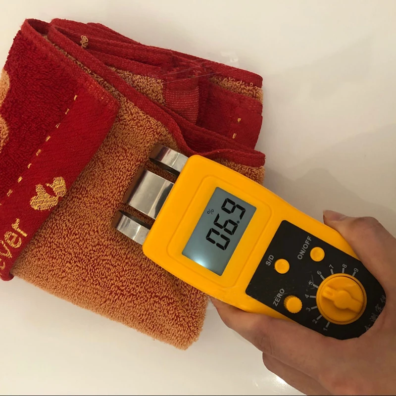 

Textile Material Moisture Tester Clothing Fabric Moisture Content Tester Cotton Yarn Moisture Regain Measuring Instrument DM200T