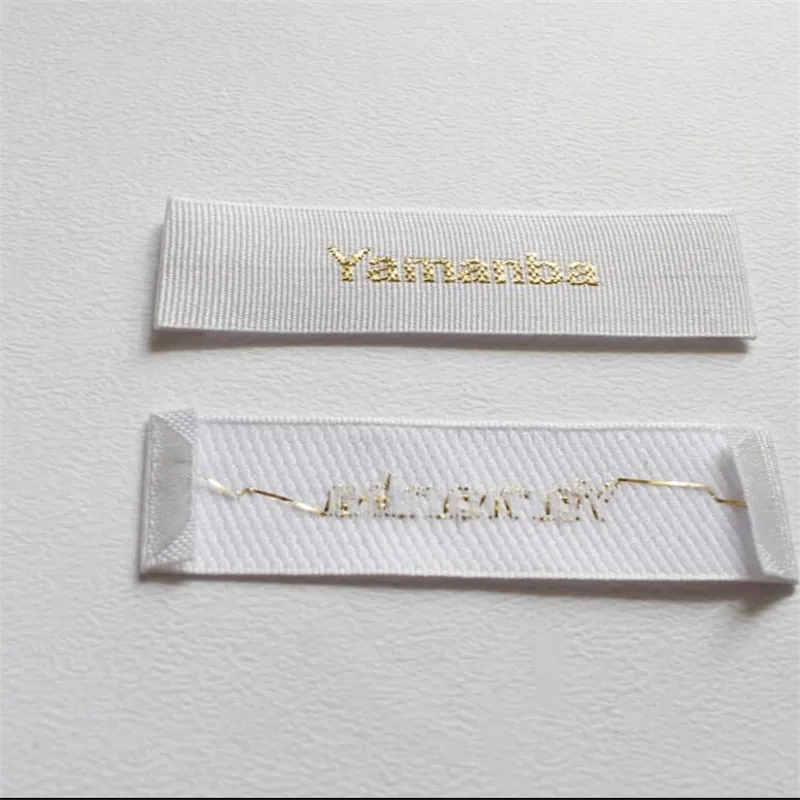 

Factory Price Custom Woodclover satin weave label vertical stripe gold thread font