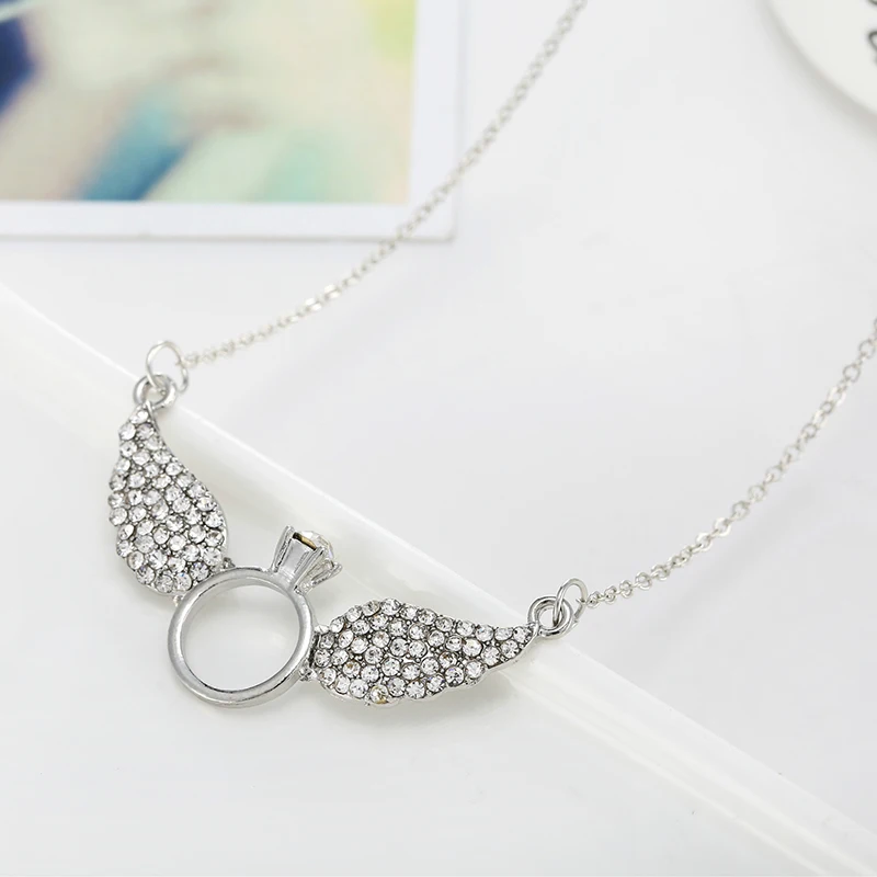 Ожерелье с подвеской в виде крыла кристаллами золотого цвета|necklace pendant gold|stone