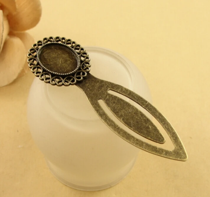 

20pcs/lot) 79*24MM Inner size:13x18mm Alloy Antique Bronze Bookmark Jewelry Cameo Cabochon Base Settings Finding