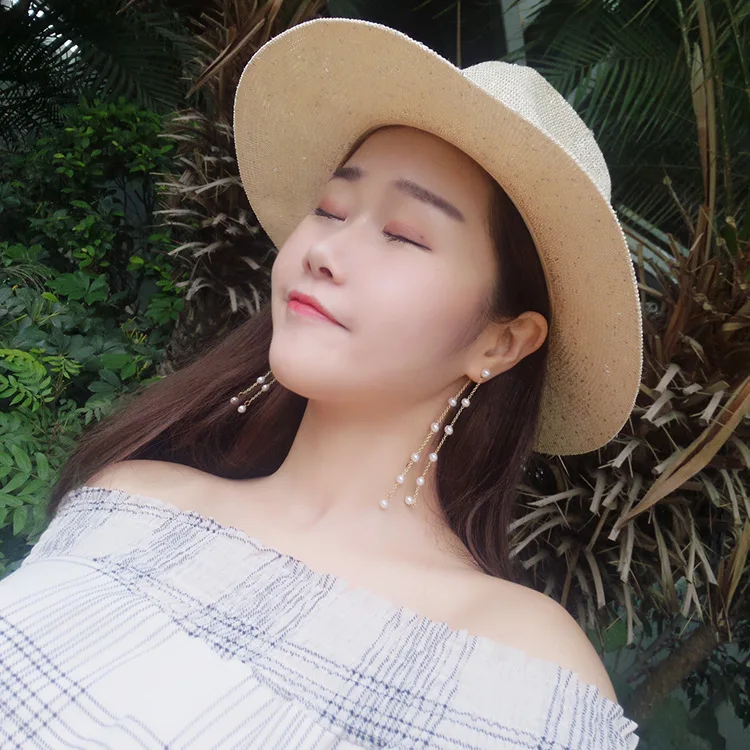 Женские двухрядные длинные серьги с кисточками выполненные вручную в