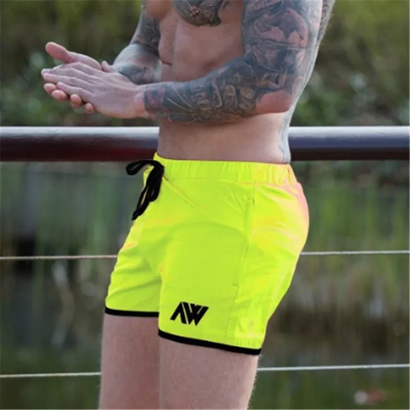 Fluorescent green Летние Новые мужские повседневные дышащие быстросохнущие шорты для бодибилдинга, бегунов, фитнеса, обтягивающие мужские спортивные штаны - Цвет: Fluorescent green