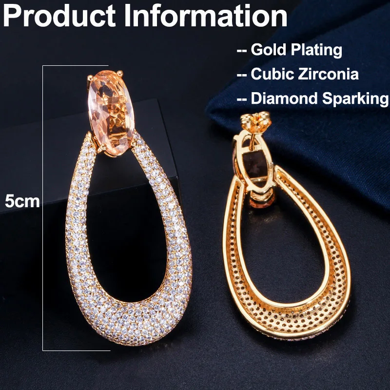 Женские Длинные круглые серьги-подвески с фианитами цвета шампанского |