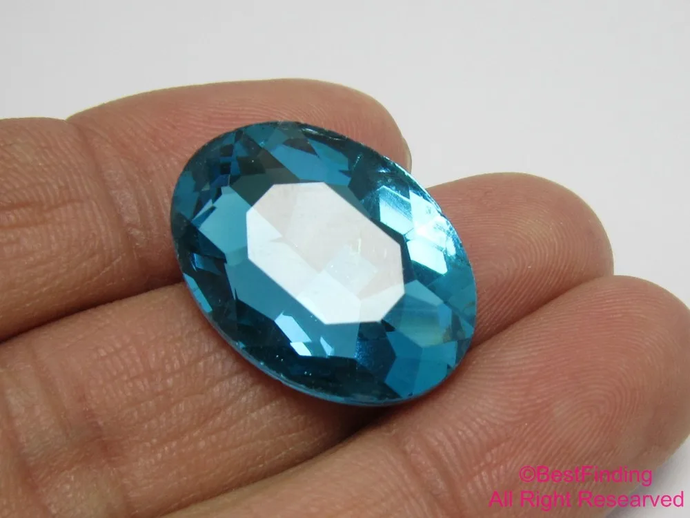 

25x18mm Faceted bumper cabochon Light blue crystal with silver buttom