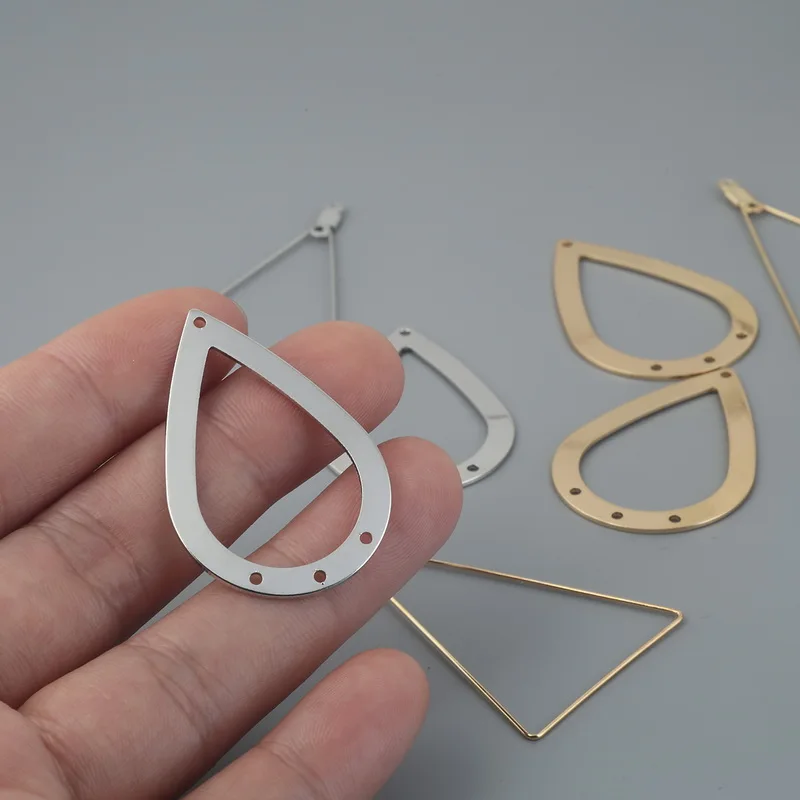 Женские металлические серьги-подвески серебристые/золотистые треугольные