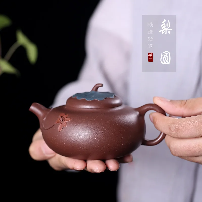 

Ore Mine Purple Mud Pear Round Lotus Leaf Mud Painting Teapot National Industrial Suyefei Handmade Teapot Wholesale