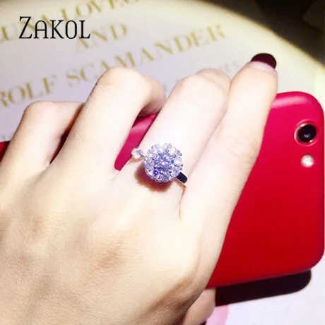 Женское кольцо ZAKOL регулируемое с вращающимся цветком и кристаллом циркония FSRP253