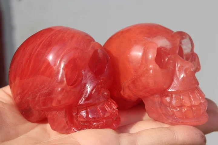 

2 red SMELT QUARTZ CRYSTAL skull HEALING