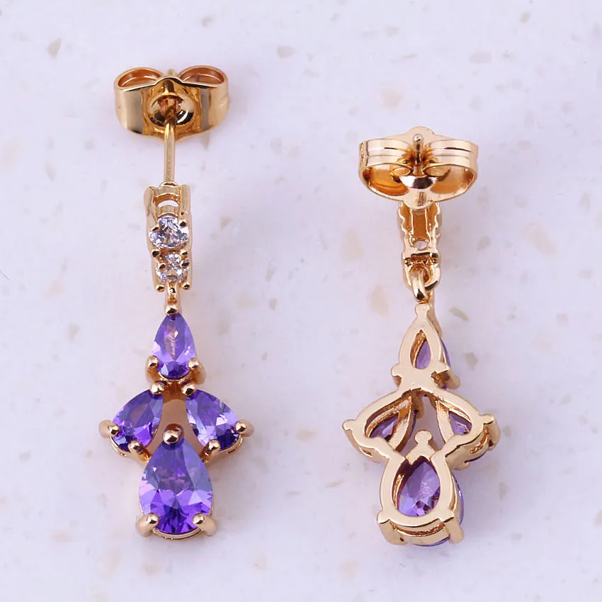 Привлекательные висячие серьги фиолетового цвета с кристаллами желтого золота