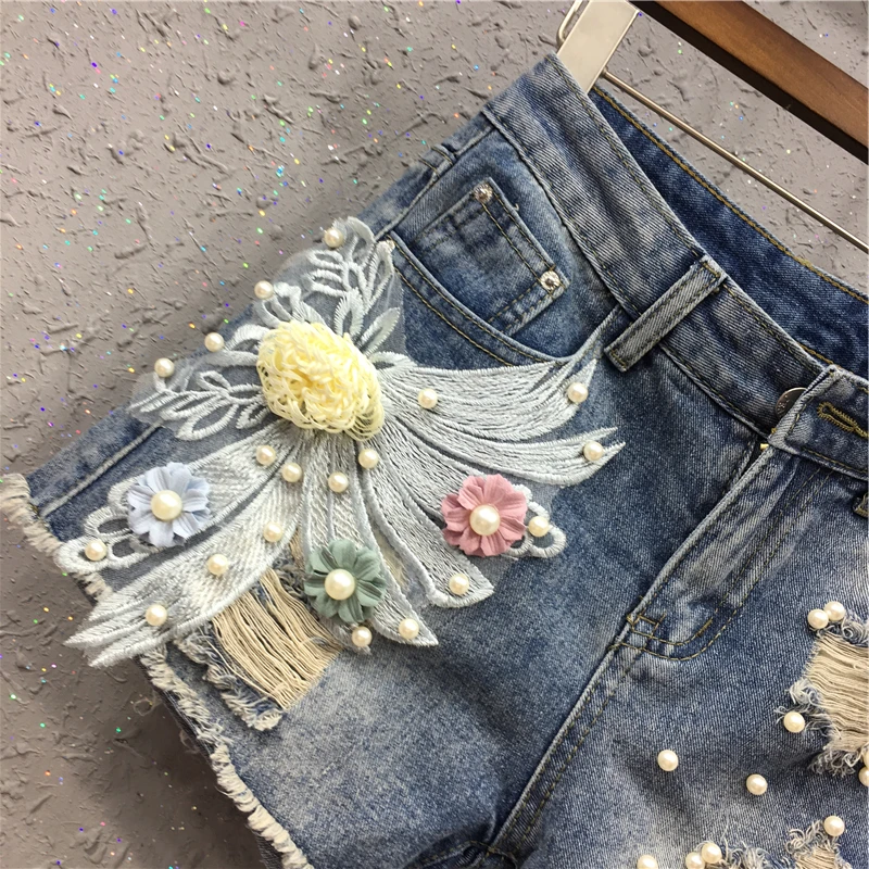 

New short Jeans Shorts Female Summer 2019 Pierced Nail Pearl Flower Embroidery Slim Broad legged Hot