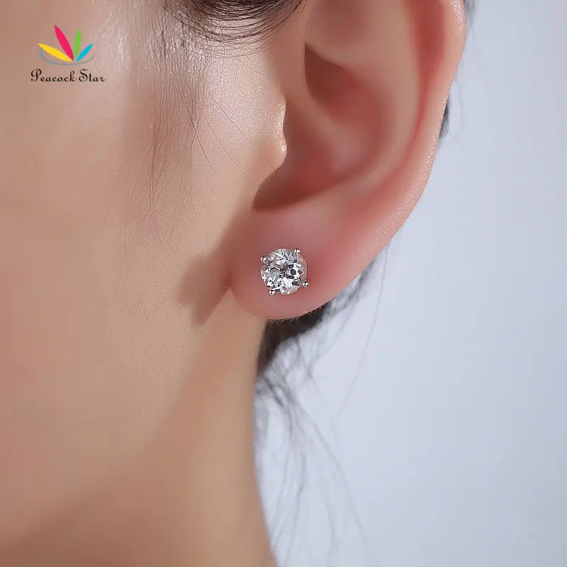 Серьги гвоздики из белого золота 14 к с павлиньими звездами натуральный чистый