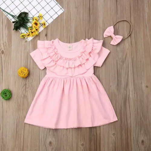 Розовое платье трапециевидной формы с оборками и короткими рукавами для