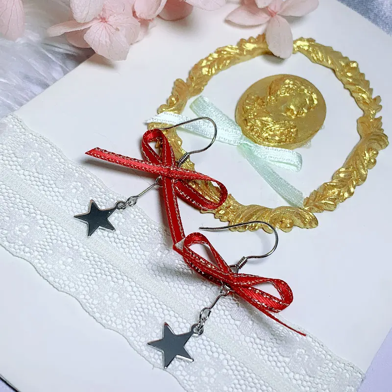 

Женские серьги из серебра 925 пробы с красным бантом