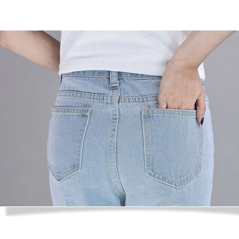 Летний джинсовый спортивный костюм женский из двух предметов модные рваные