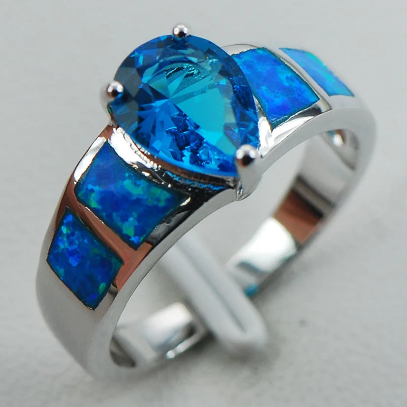 

Кольцо из серебра с голубым кристаллом цирконием и белым опалом, размеры 6 7 8 9 10 R1274