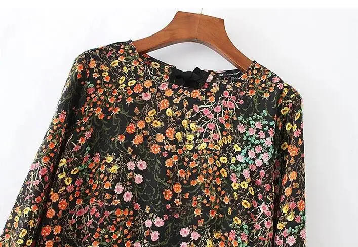 Женский комбинезон с завязками на спине черный пикантный круглым вырезом