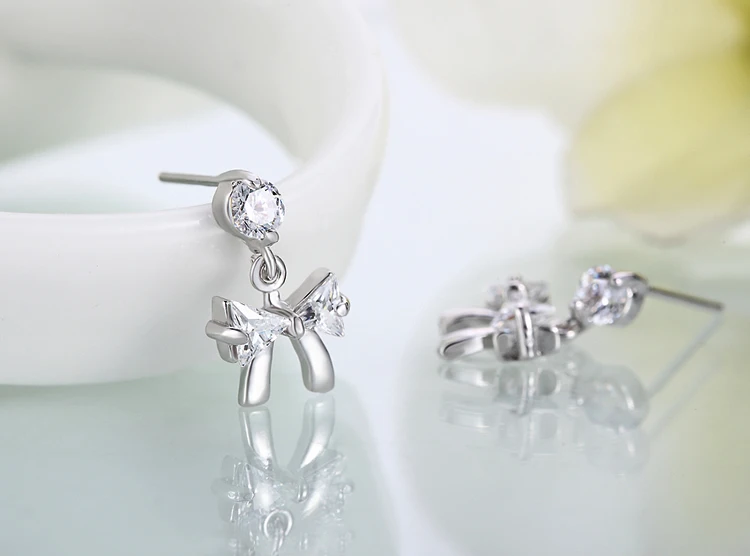 Женские посеребренные серьги-гвоздики с бантом Y | Украшения и аксессуары