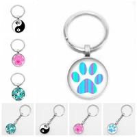 hot new hot cartoon pet paw footprint key ring round glass cabochon animal dog cat claw mode key ring pendant wholesale