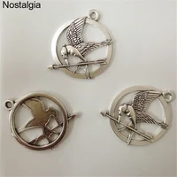 nostalgia 20pcs the hunger games ridicule bird charms movie jewelry pendant 2829mm