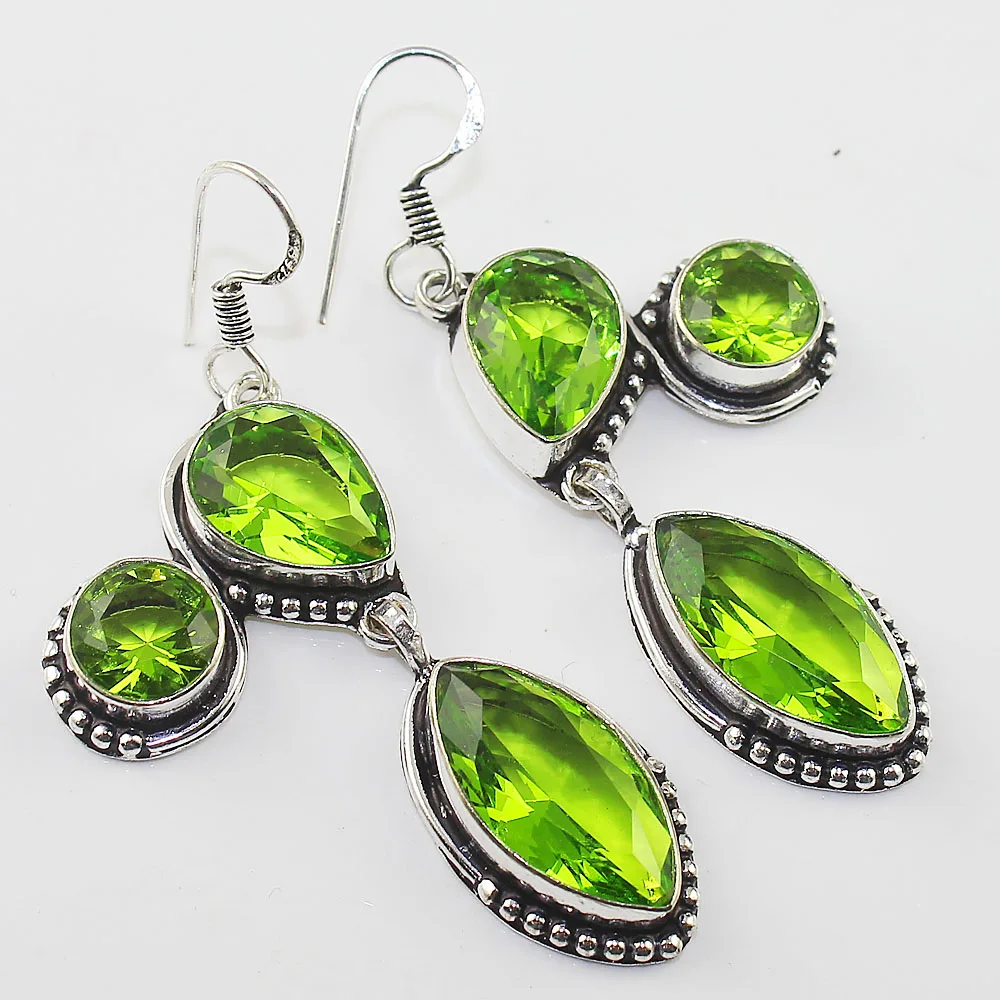

Peridot Earring Silver Overlay over Copper ,59 mm, E0934