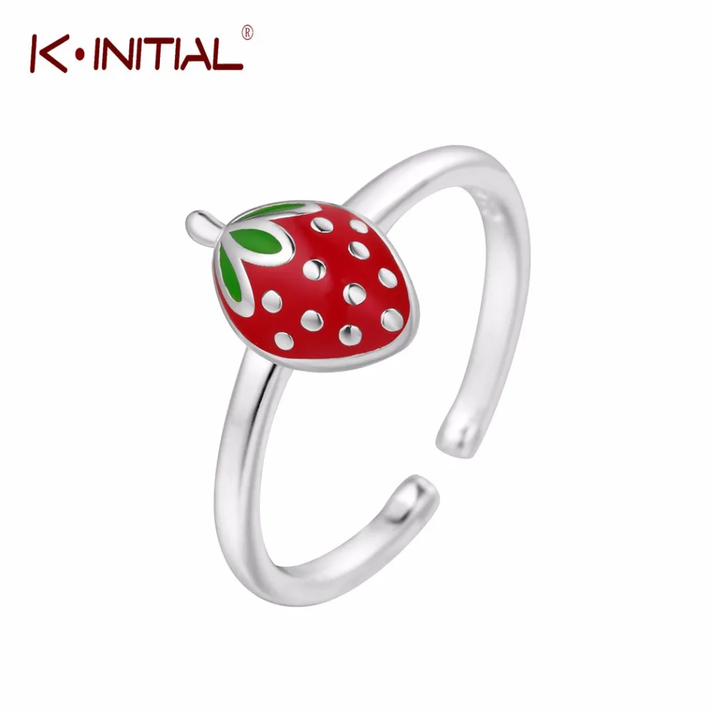 Кольцо Kinitial серебряного цвета с подвеской в виде красной клубники