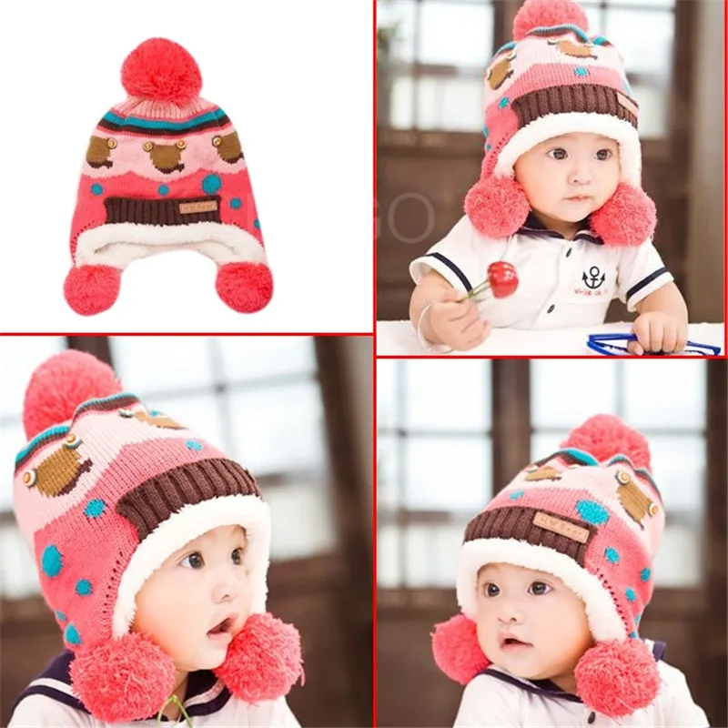 Милая детская зимняя теплая шапка двухслойная вязаная с меховыми помпонами