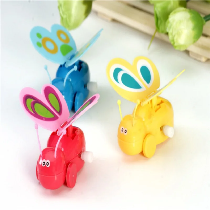 1 шт. Мультяшные пластиковые игрушки цветные заводные на цепочке ходьба с