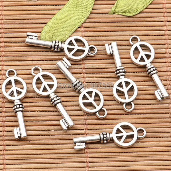 

38Pcs tibetan silver tone 2sided key of peace sign design charms H0887