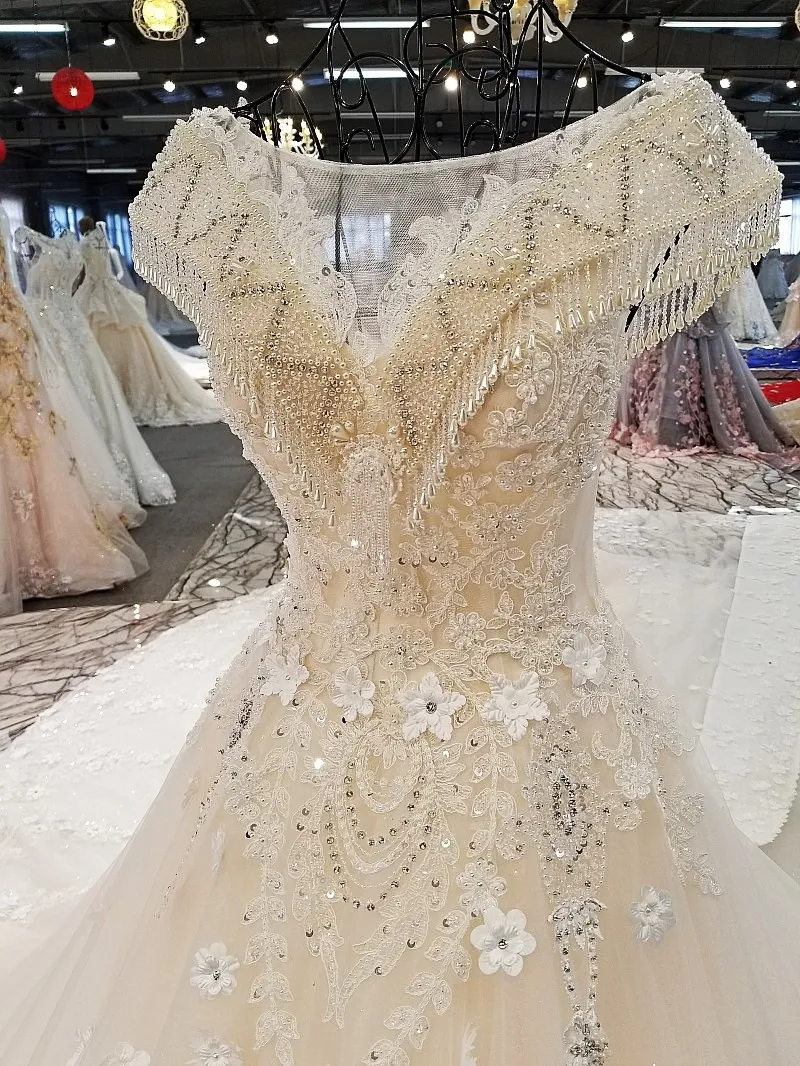 LS00302 свадебное платьебез спинки крышка рукава большой лук назад кружева бальное