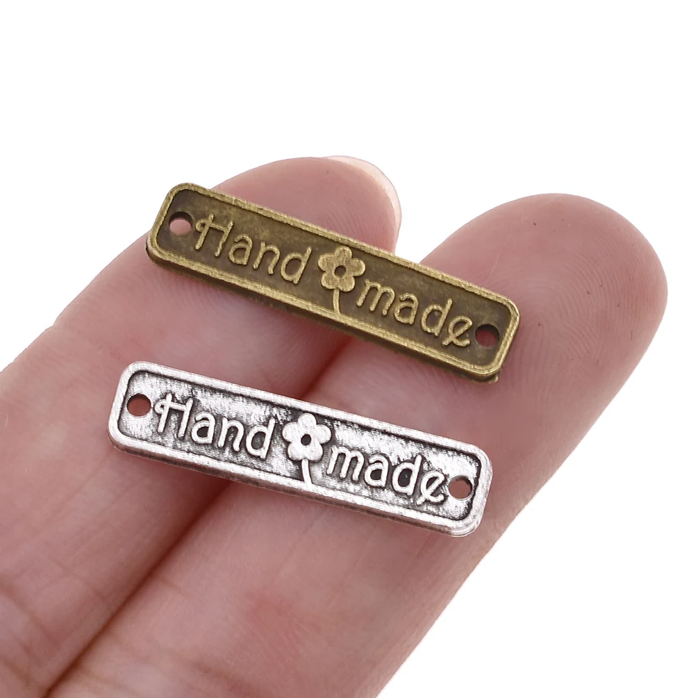

100Pcs/lot 2.50x0.60cm Metal Alloy Handmade Letter Printed Labels Double Hole Clothing Labels For Garment Diy Sewing Materials