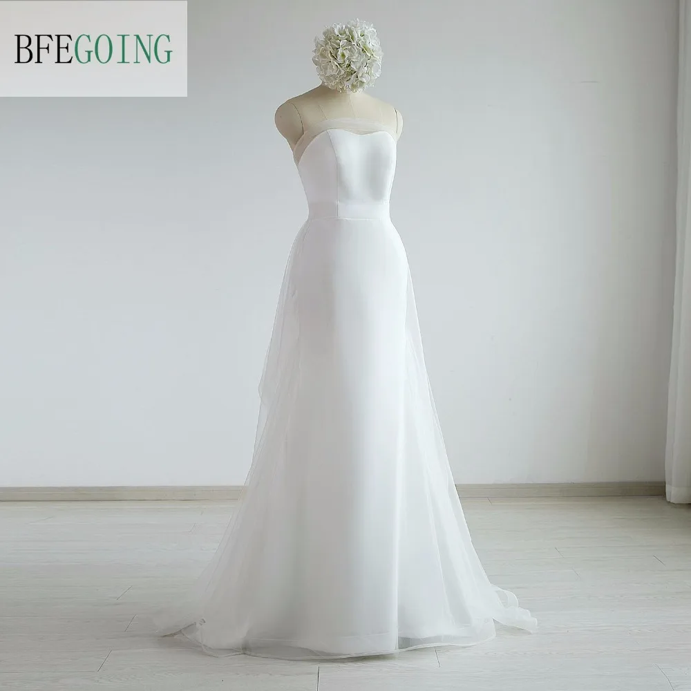 Свадебное платье из тюля цвета слоновой кости трапециевидной формы с длинным