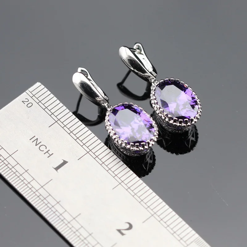 Женские серьги подвески серебряного цвета овальные с фиолетовым фианитом