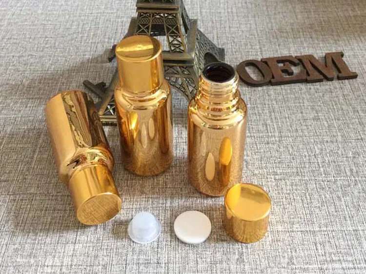 

Hot sale 20ml golden high quality essential oil bottle glass bottle wholesale 20ml capsule 10pcs/lot