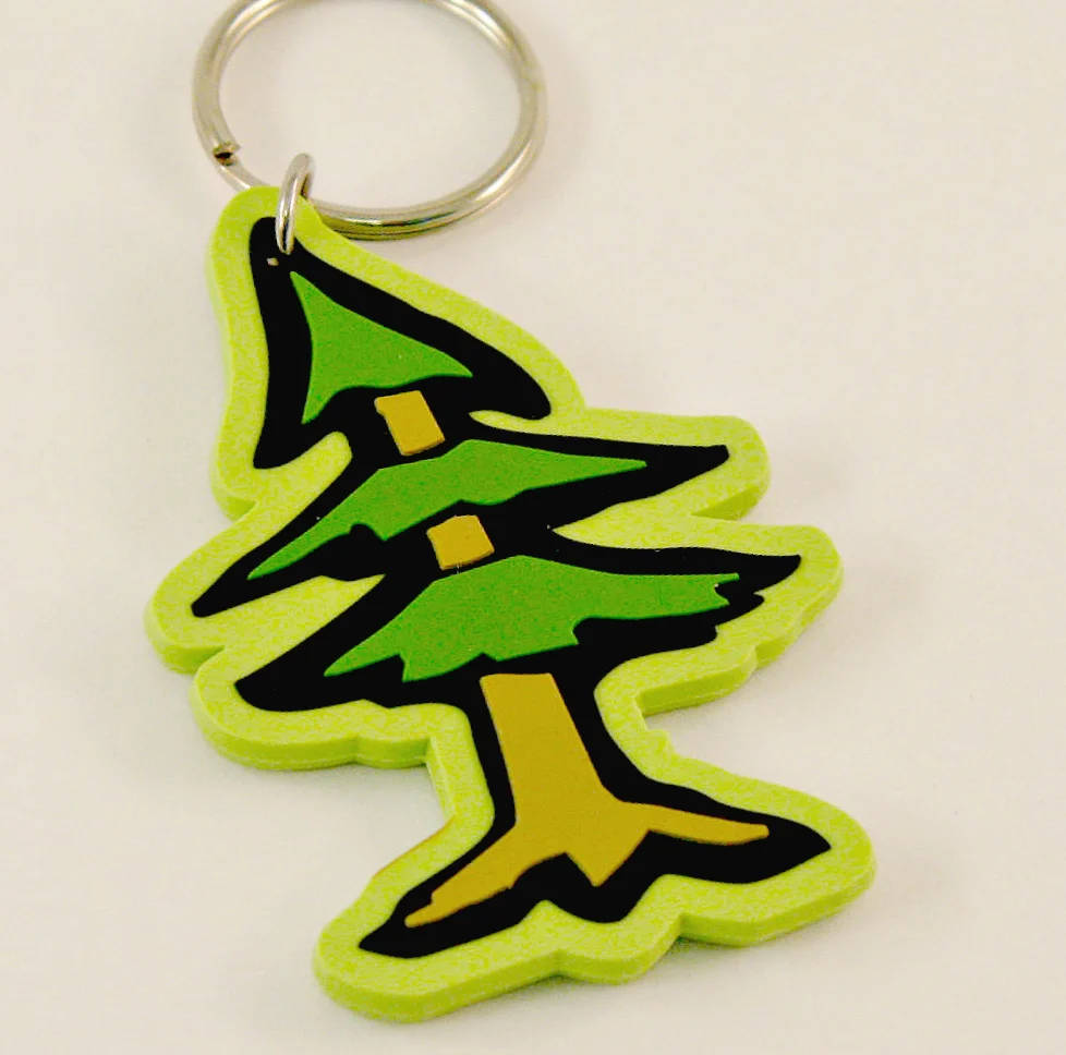 Изготовленные на заказ брелки из ПВХ с резиновым кольцом зеленым деревом