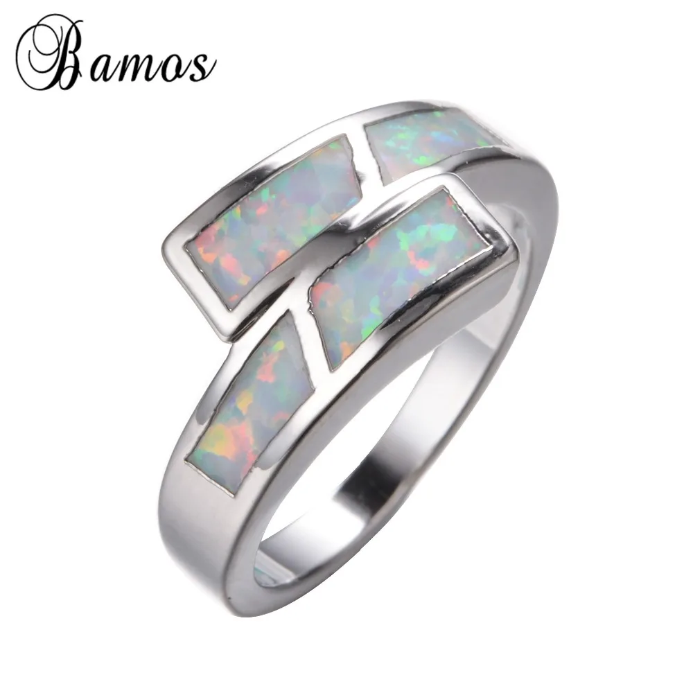 Кольцо женское и мужское из белого золота с радужным огненным опалом | Украшения