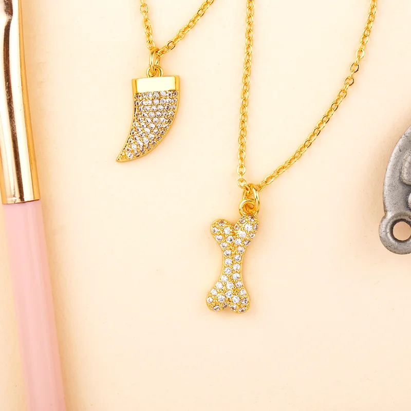 Ожерелье с подвеской в виде кости собаки золотистого цвета|Ожерелья подвеской| |