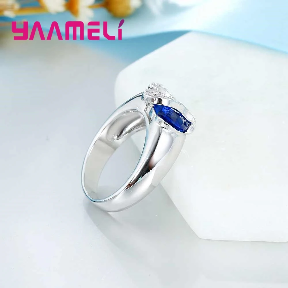 Модное свадебное обручальное кольцо с голубым кристаллом и белым орнаментом в