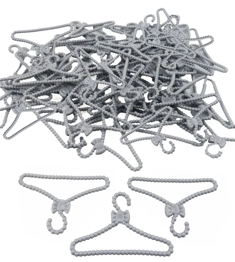 

20 Pcs/Lot Doll Accessories Plastic Silver Gray Bowknot Hanger Dress Outfit Girl Pretend Play House For 12 Inch Doll Accessories