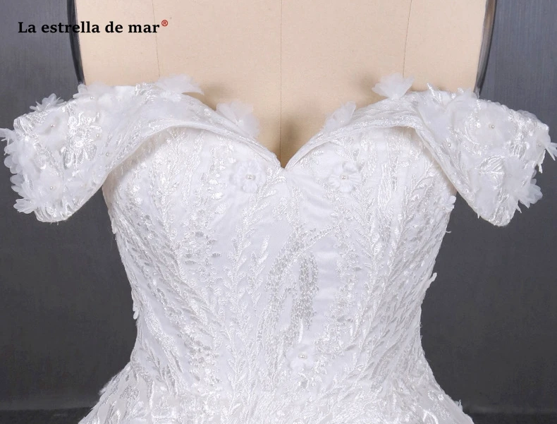 

Vestido de noiva new tulle flower beaded Boat Neck short sleeve A Line ivory white wedding gowns trailing gelinlik luxury