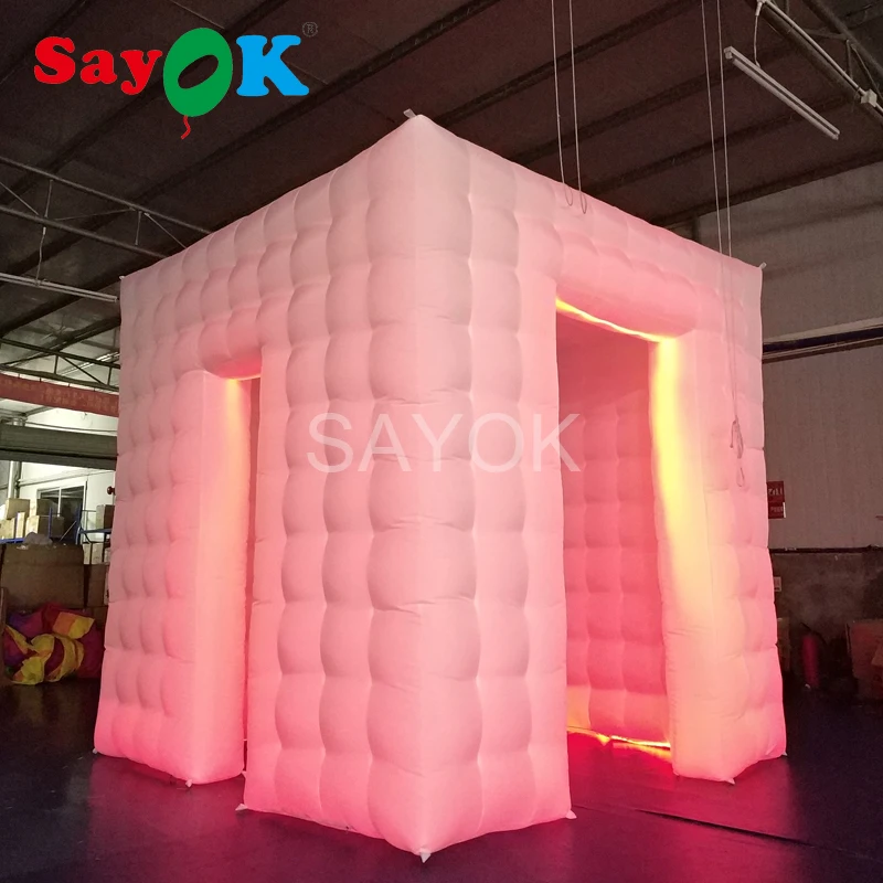 

Sayok Portable Inflatable Photo Booth Enclosure Tent Two Doors with 17 Colors LED Changing Lights for Wedding Party Decoration