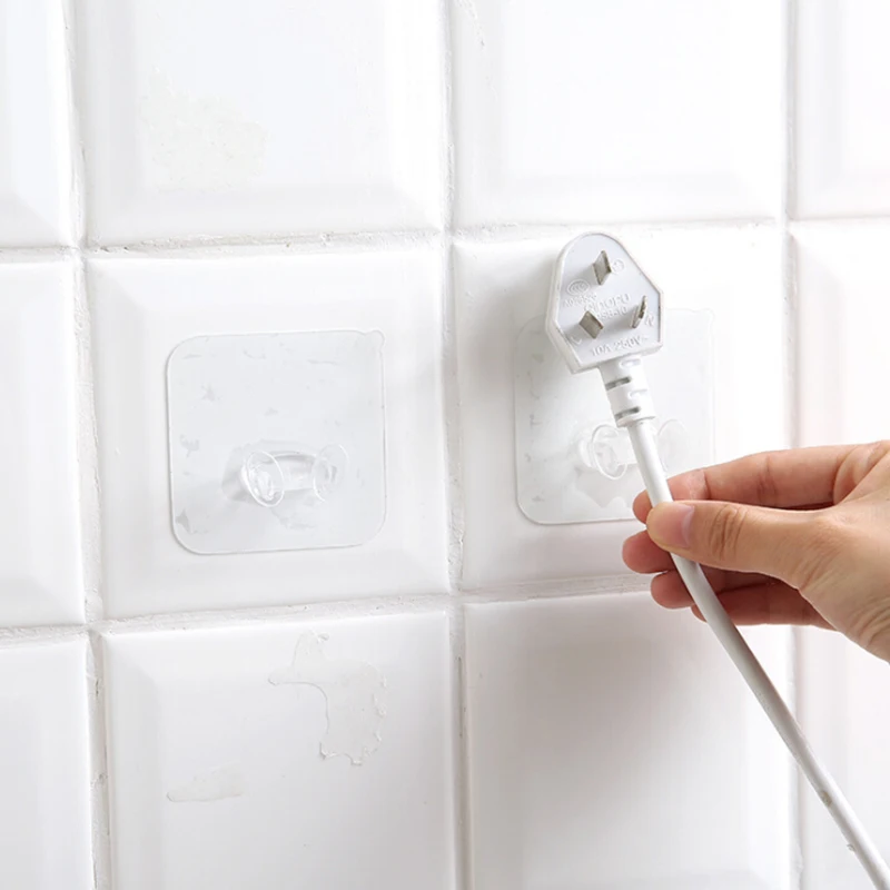 

4Pcs/lot New Clear Home Office Wall Adhesive Plastic Power Plug Socket Holder Hanger Wall Storage Hook