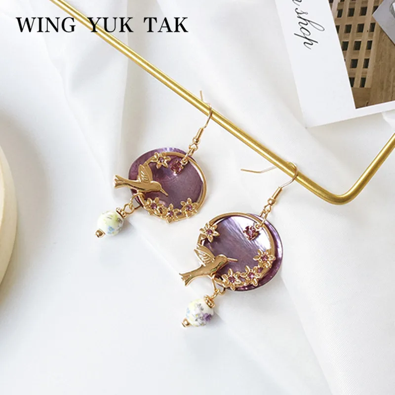 Женские богемные серьги в виде птиц wing yuk tak фиолетовые с ракушками модные