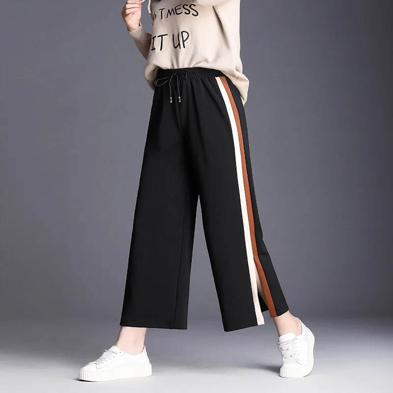 Женские свободные штаны с поясом и студенческими штанами полосками по бокам